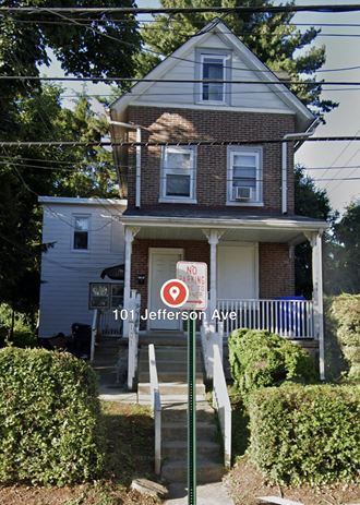 a house with a no parking sign in front of it
