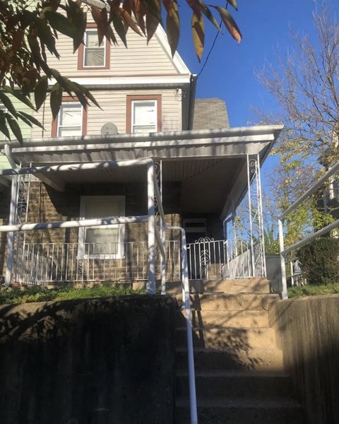 a view of a house with a staircase in front of it