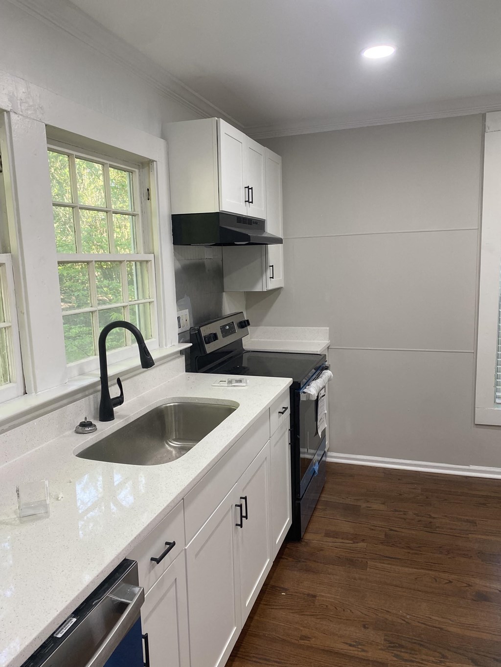 a kitchen with a sink and a window