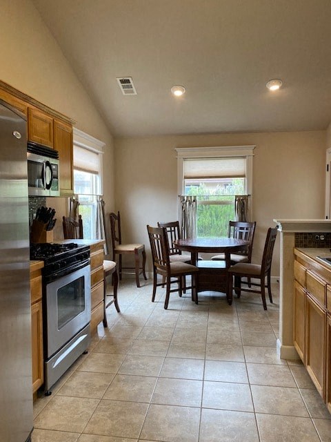 a kitchen and dining room with a table