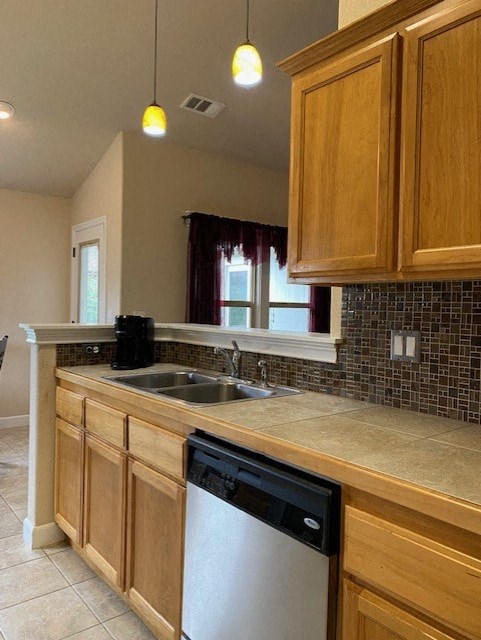 a kitchen with a sink and a dishwasher