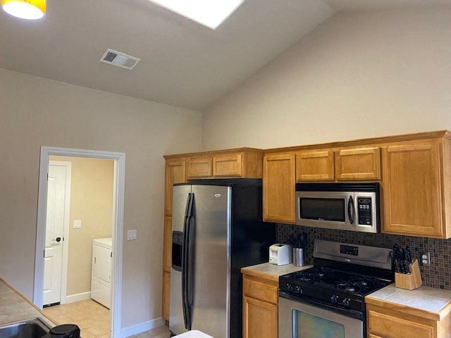 a kitchen with a stove and a refrigerator