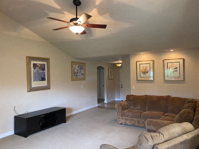 a living room with a couch and a ceiling fan