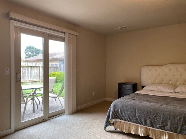 a bedroom with a bed and a patio door