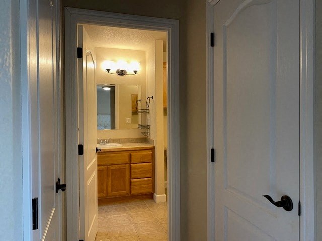 a bathroom with a sink and a mirror and a door