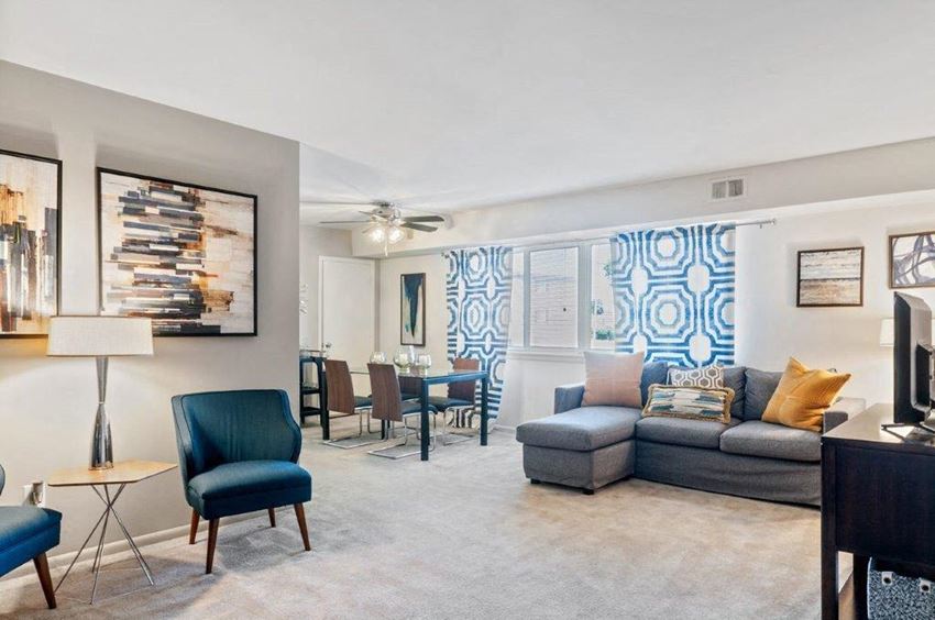 a living room with a couch and a dining room table