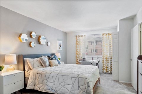 a bedroom with a bed and a window