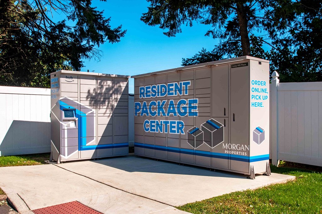 a portable restroom is shown in front of a white fence