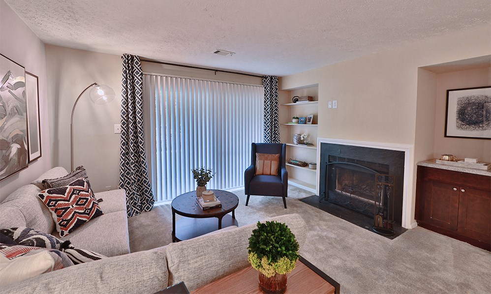 a living room with a fireplace and a couch