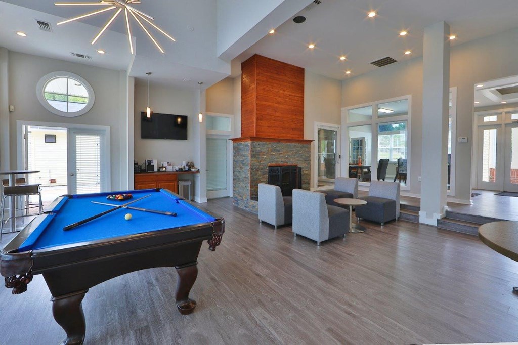 a pool table in the middle of a living room