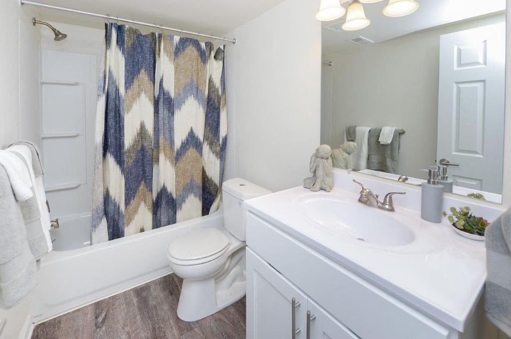 a bathroom with a sink toilet and a shower