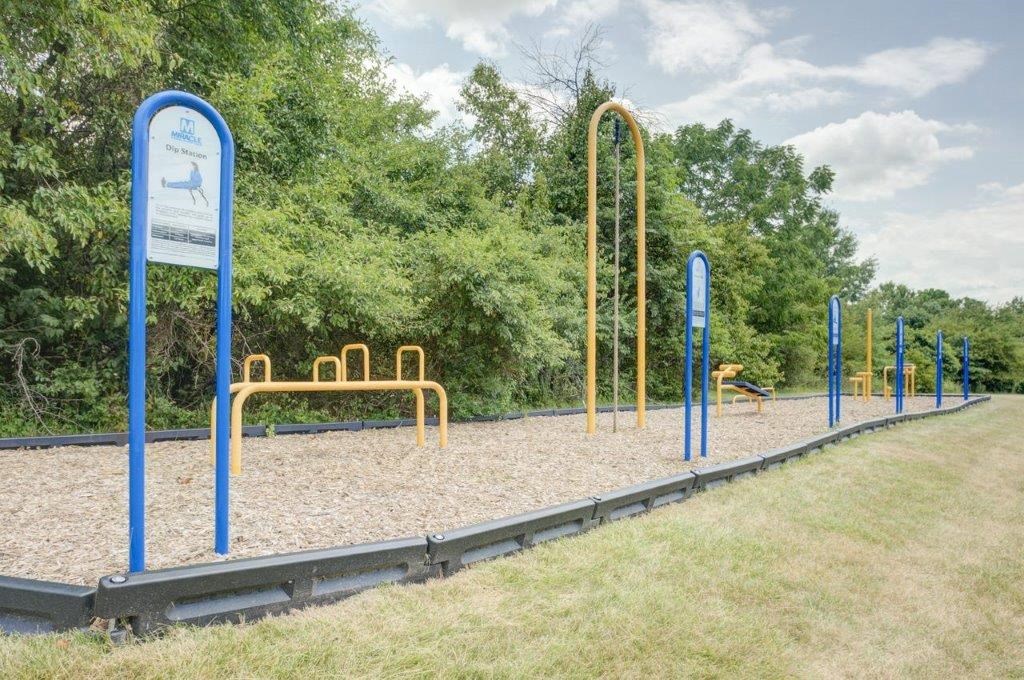 a playground in a park on a sunny day