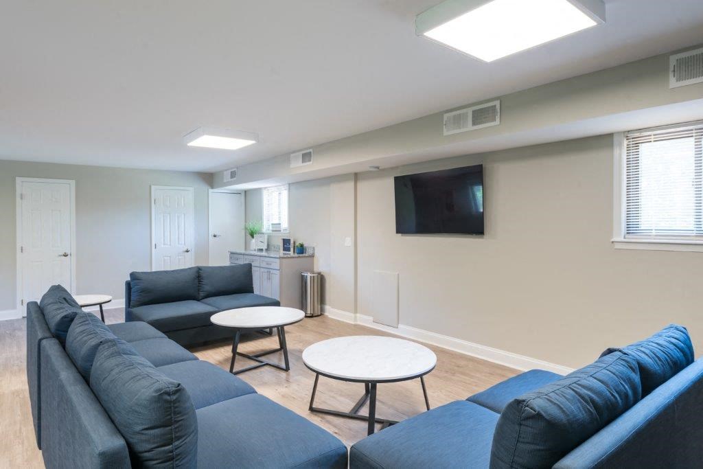 a living room with couches and a table