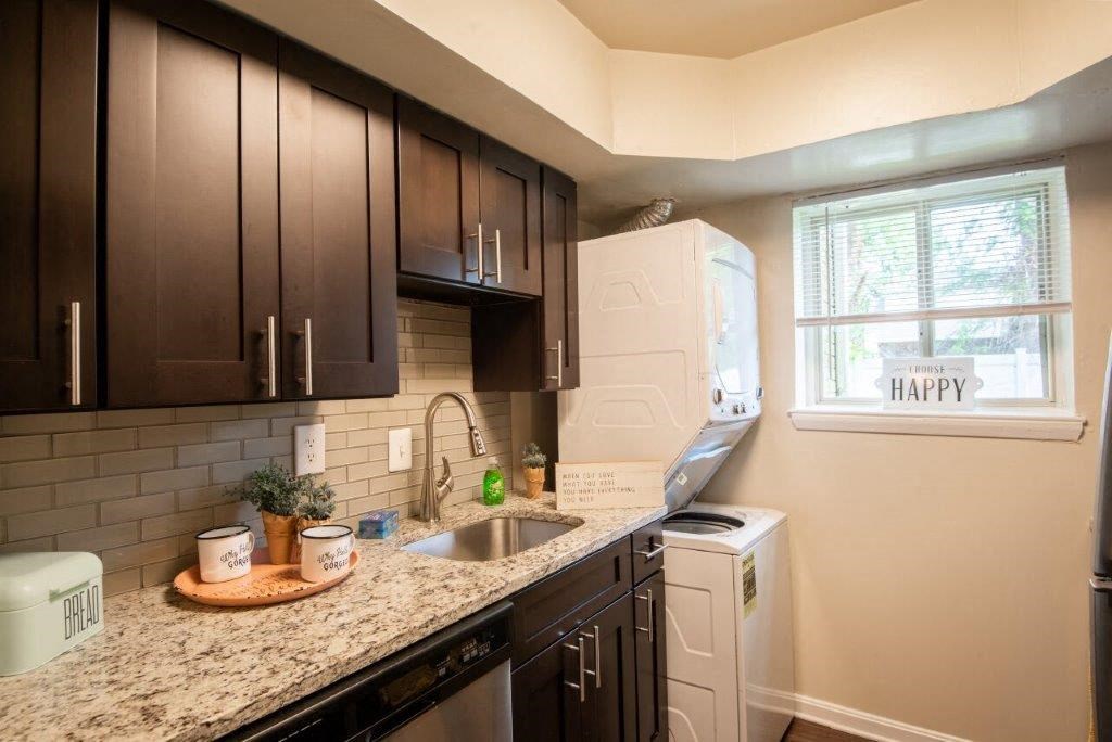 a kitchen with a counter top and a sink