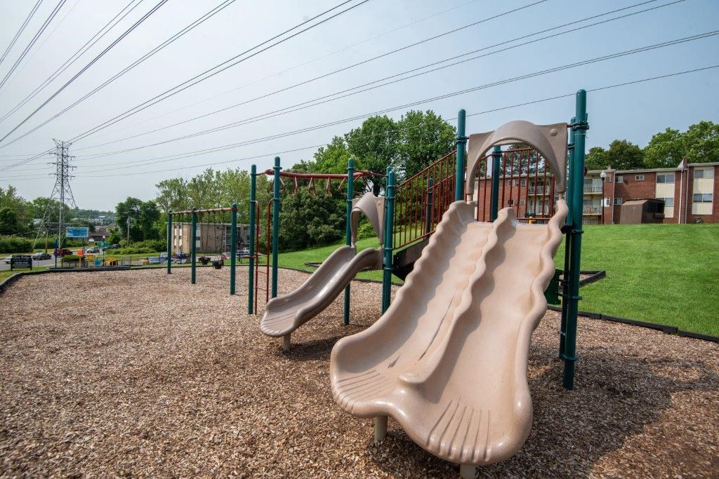 a playground with slides at a park