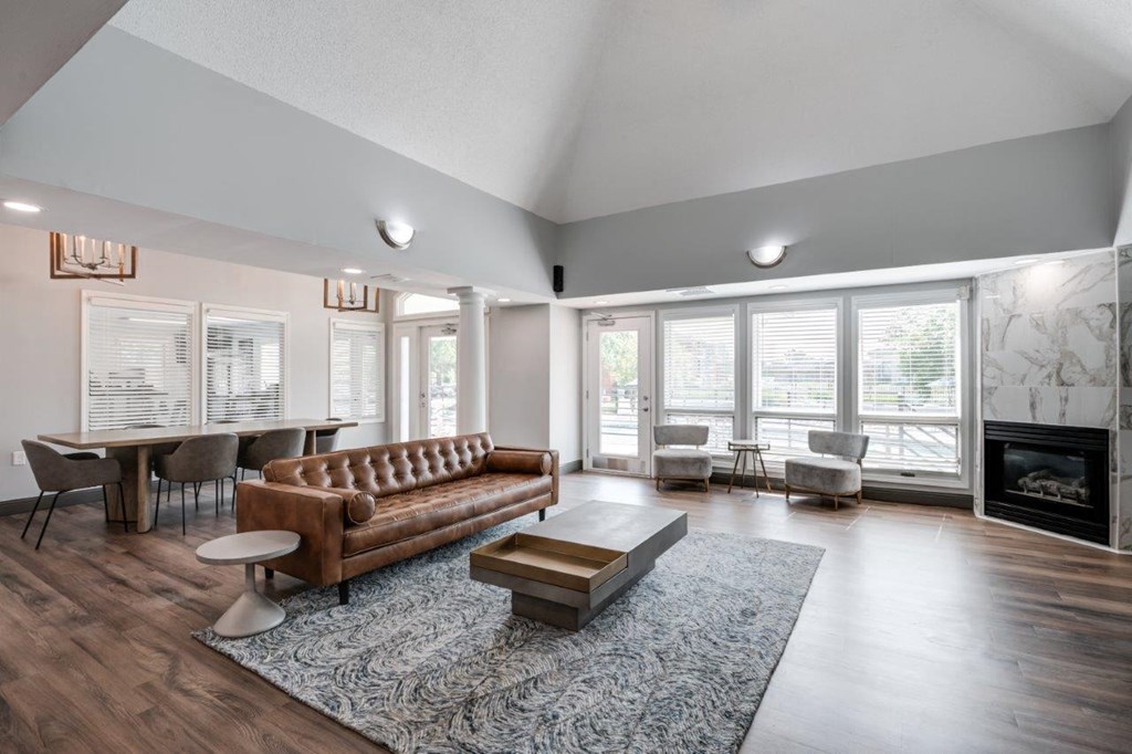 a living room with a couch and a table and a fireplace