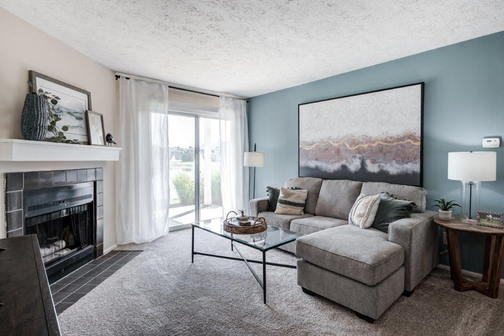 a living room with a fireplace and a couch