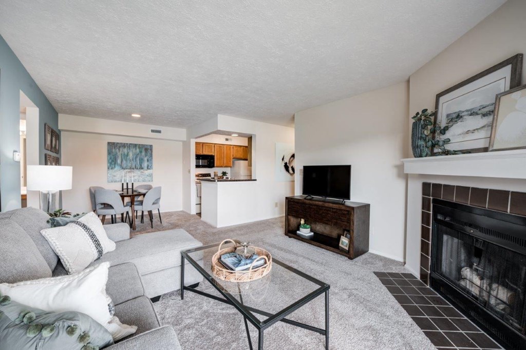 a living room with a fireplace and a couch