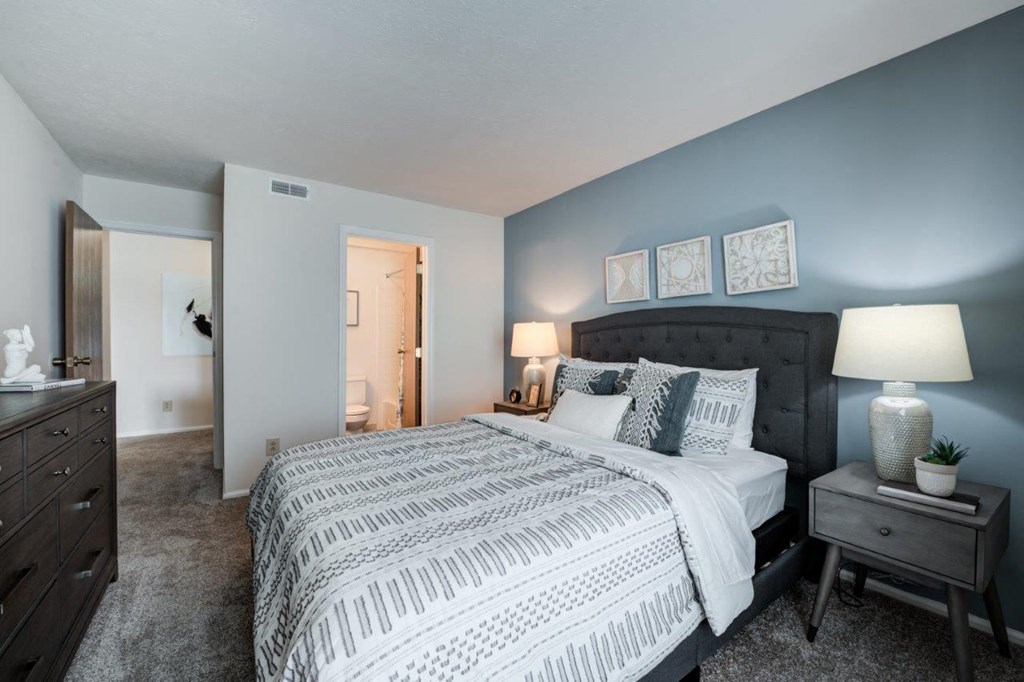 a bedroom with a bed and a closet