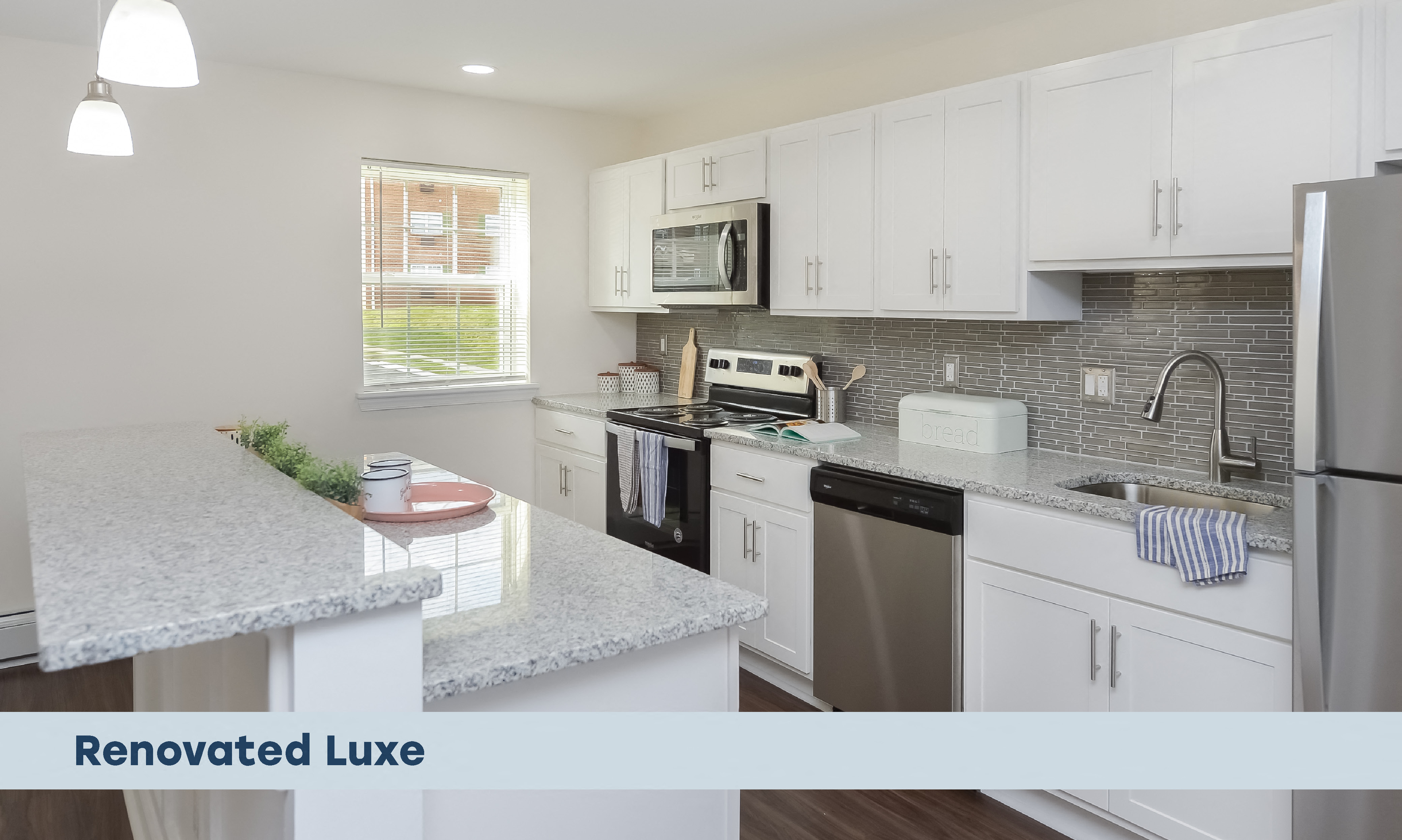 a remodeled with white cabinets and granite counter tops