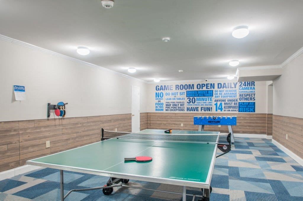 a game room with a ping pong table