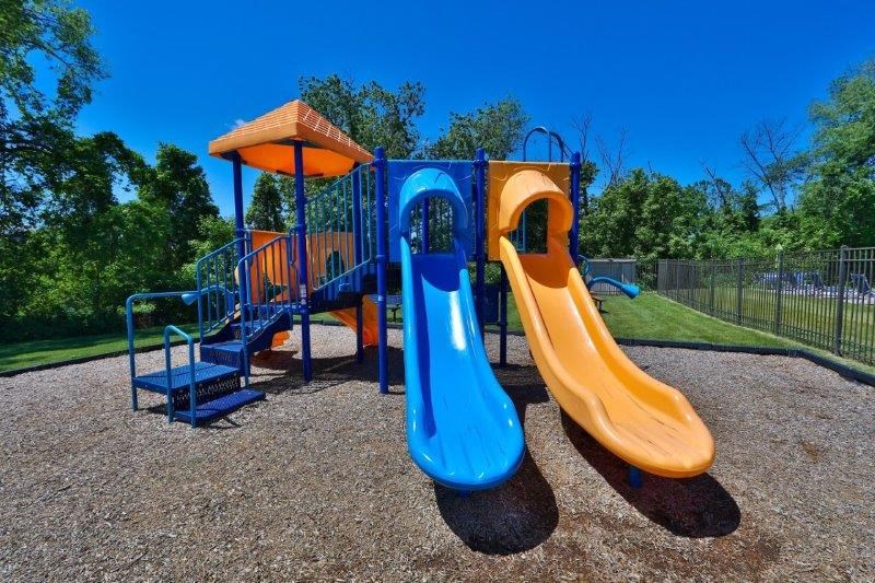 a playground with slides and a swing set