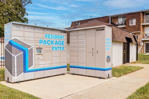 a small building with a restroom and a driveway next to it
