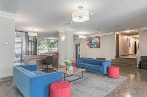 a living room with blue couches and a coffee table