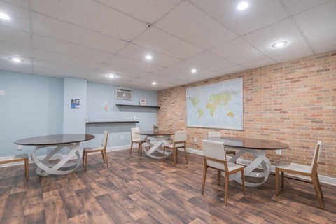 a conference room with tables and chairs and a map on the wall