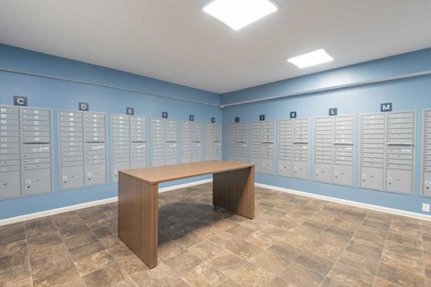 a room with lockers and a table in a locker room