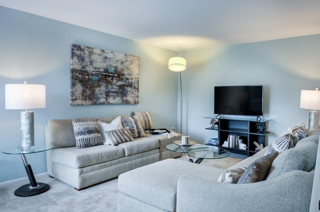 a living room with a couch and a tv