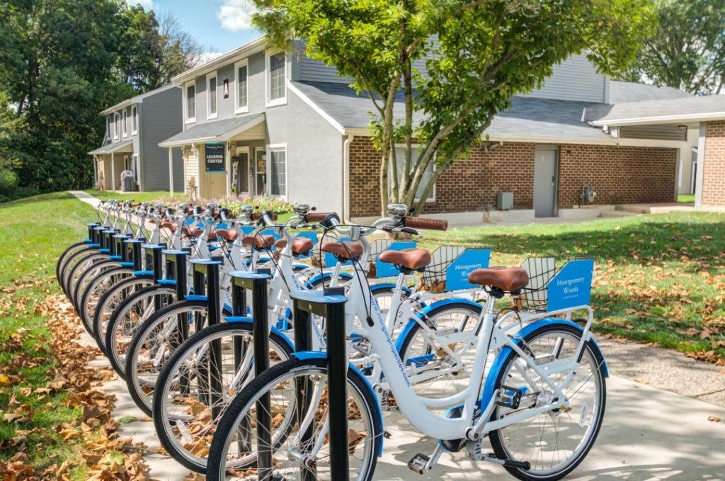 a row of bikes parked in front of a house