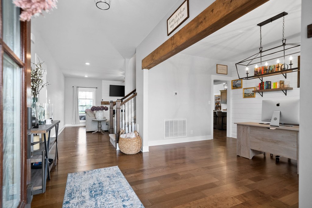 the living room is open to the dining room and kitchen