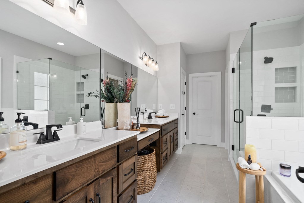 a bathroom with two sinks and a large mirror