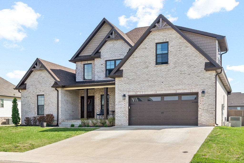 a house with a driveway and a garage door