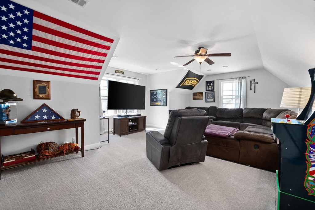 the living room has a large flag on the wall