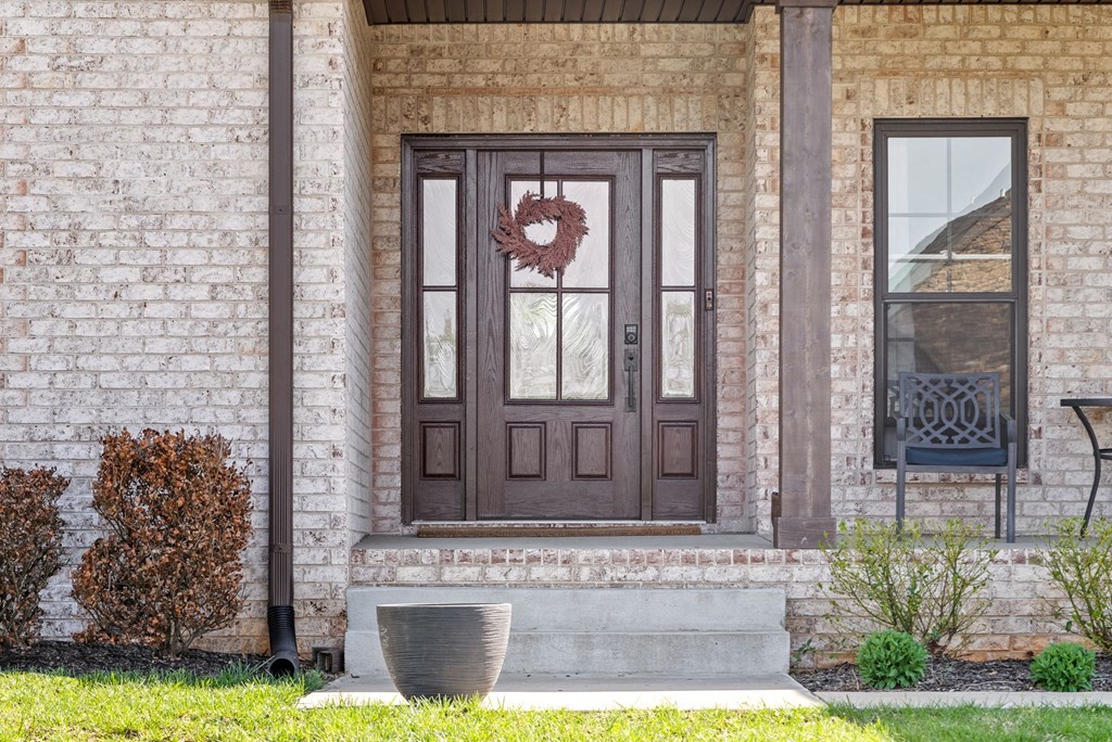 a front door of a house with a wreath on it