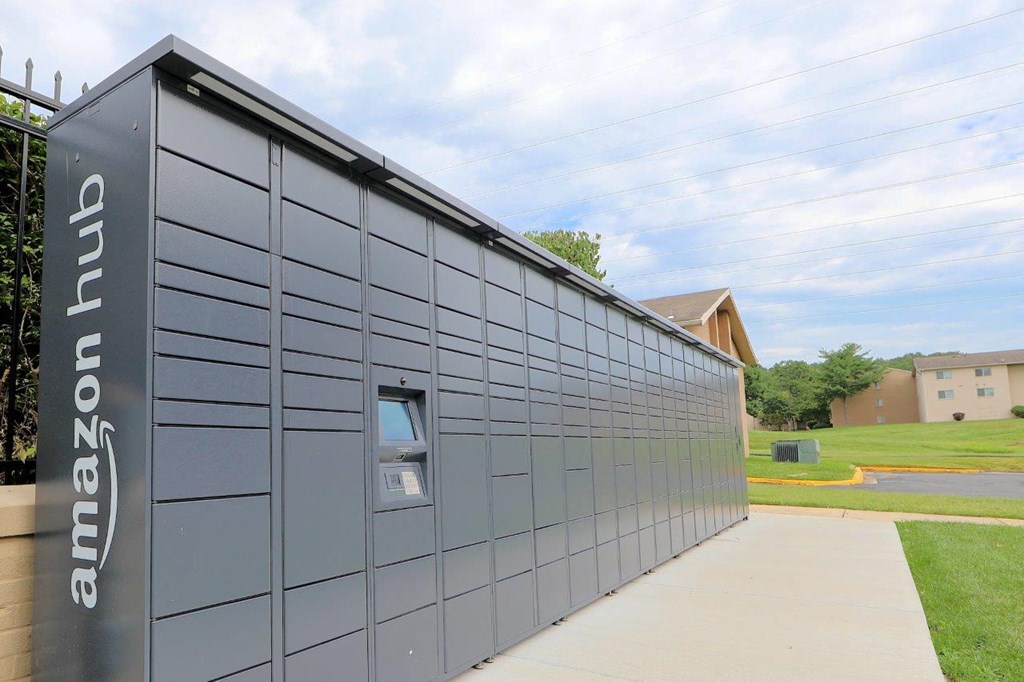 the side of a building with a sidewalk next to it