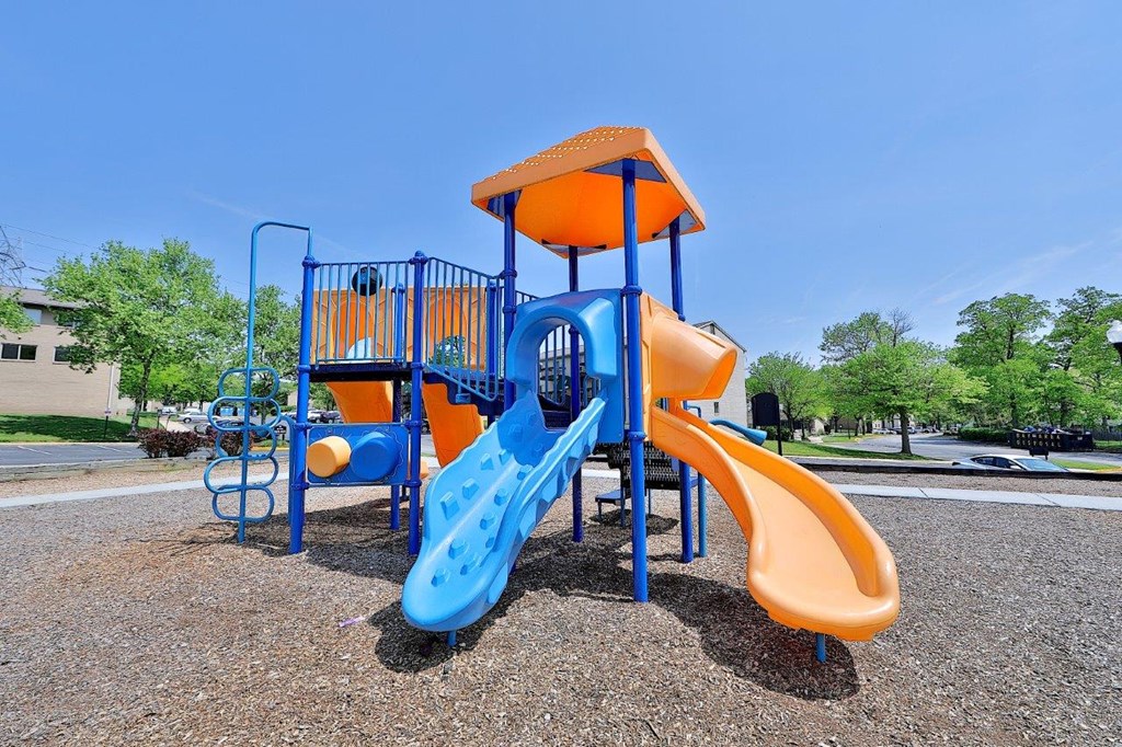 a playground at a park with a slide