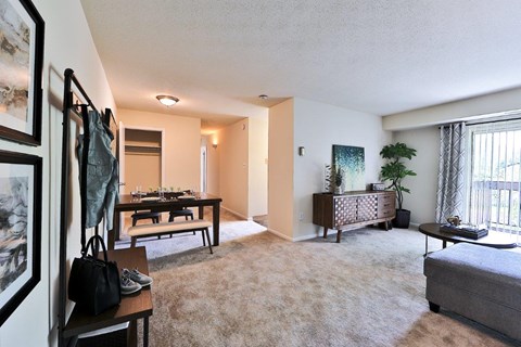 a living room and dining room with a dining table