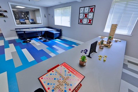a game room with a table and a board game