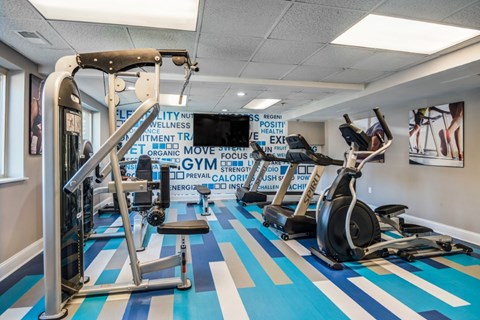 A gym with a blue and white striped floor.