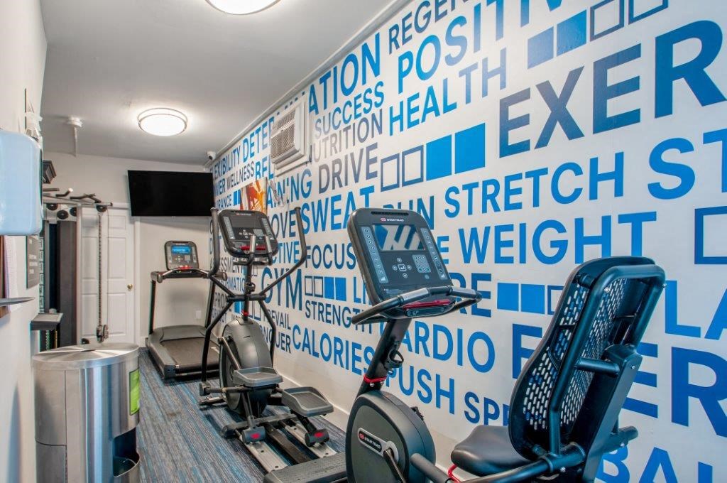 a wall in a gym with exercise machines