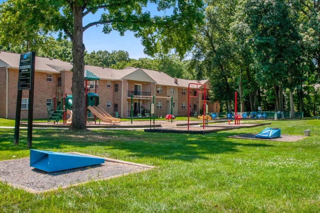 our apartments have a playground and lots of trees