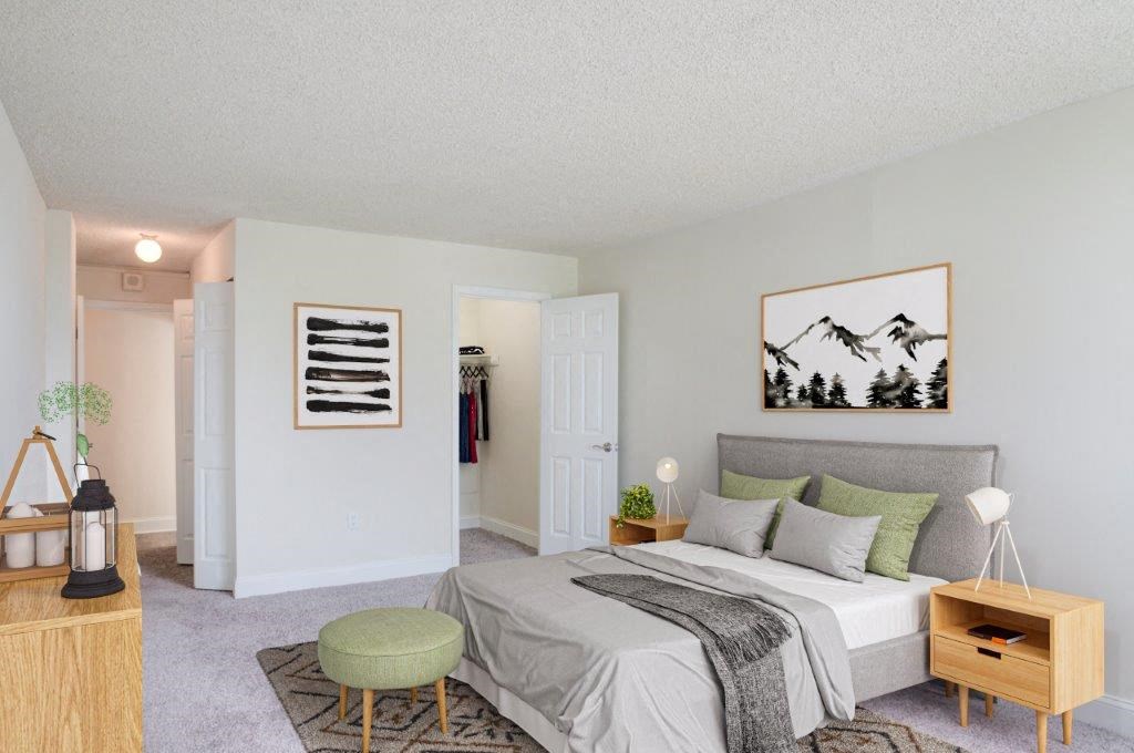 a bedroom with a bed and a closet