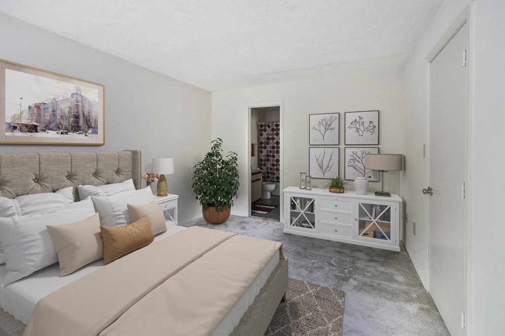 a bedroom with a large bed and a white dresser