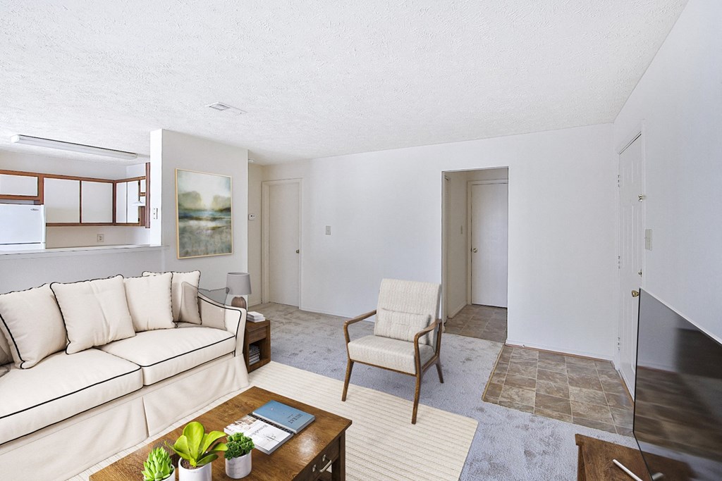 a living room with a white couch and a coffee table