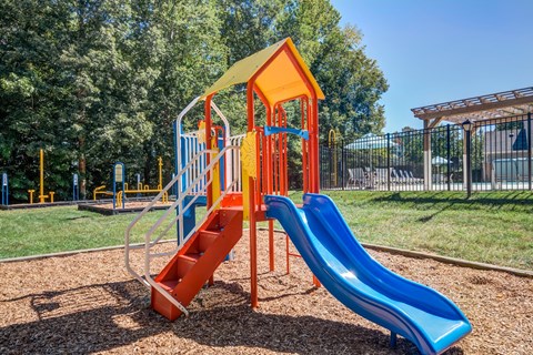 a playground with slides at a park