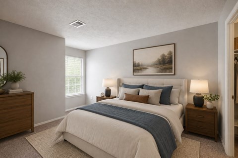 A bedroom with a bed, two nightstands, and a painting on the wall.