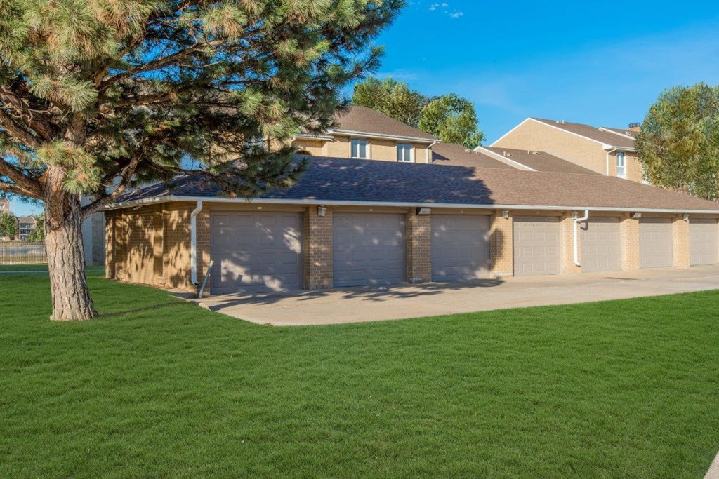 a garage with a garage door in front of a house